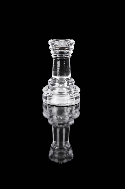 Glass chess rook on black isolated background. - Photo, Image