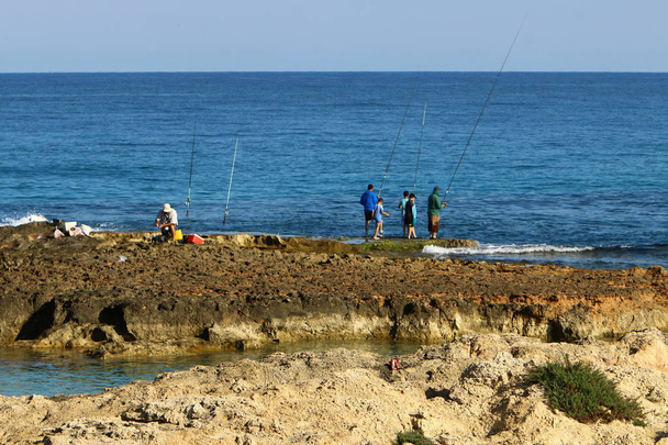 Fishermen on the beach  - Foto, afbeelding