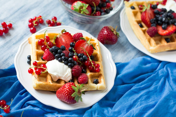 Healthy breakfast: Belgian waffles with sour cream, strawberry, raspberry, blueberry, cherry and red currant - Zdjęcie, obraz