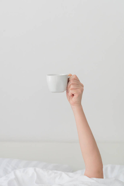 cup of coffee in hand  - Фото, зображення