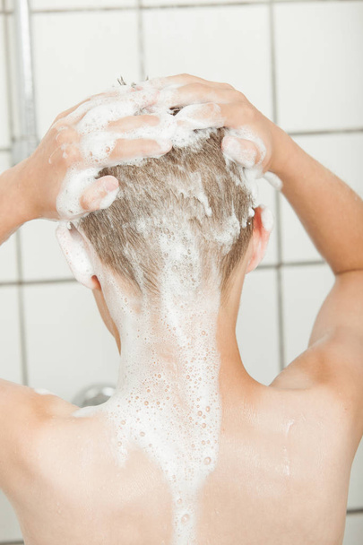 Close up on back of head covered with shampoo - Foto, imagen