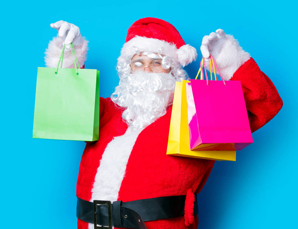 Santa Claus have a fun with shopping bags - Fotoğraf, Görsel