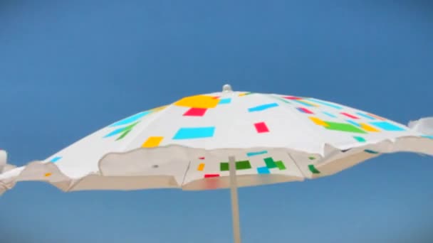 Paraguas de sol azul con patrón de Motley
 - Imágenes, Vídeo