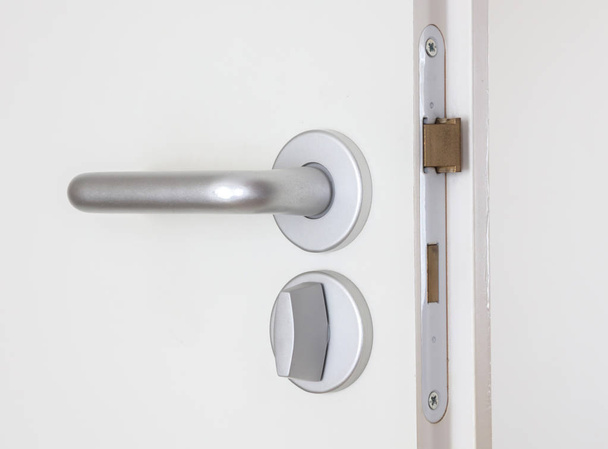 White door with chrome doorhandle - Фото, зображення