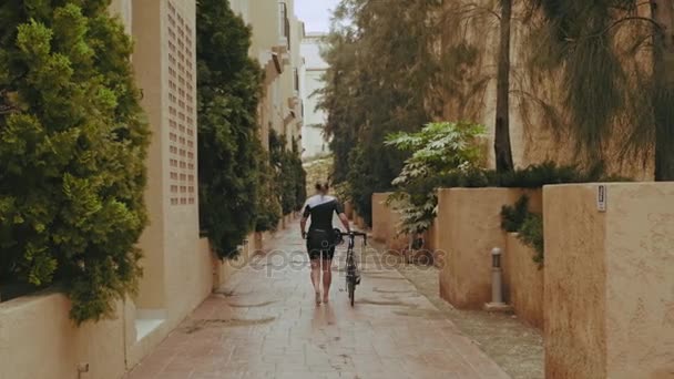 Tired young cyclist woman - Felvétel, videó