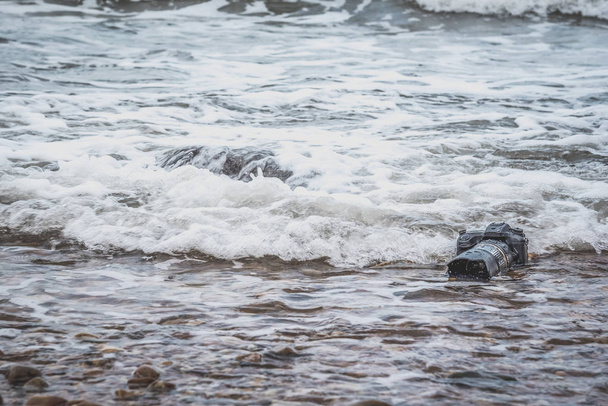 Kamera rannalla se märkä meri aalto
 - Valokuva, kuva