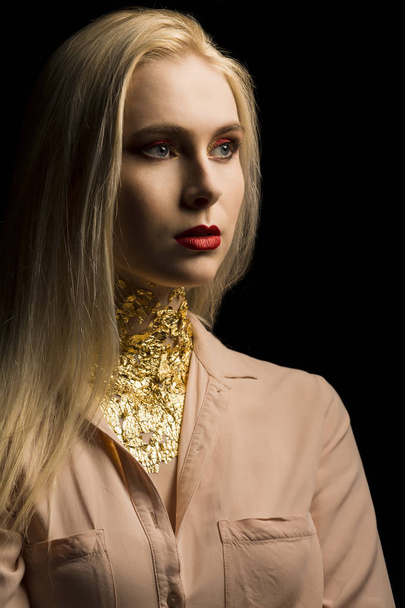 Glamorous young model with bright makeup in red color and gold f - Фото, зображення