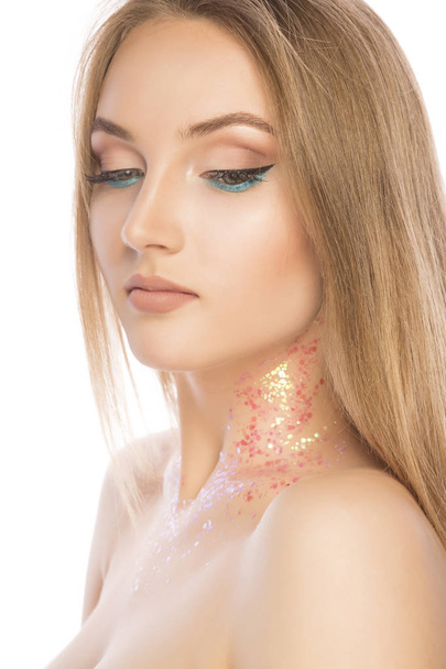 Tender young model with perfect makeup and glitter on her neck.  - Photo, Image