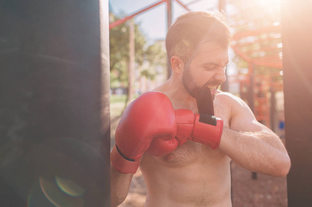 Young man boxing workout. Boxer Exercise Athletic Boxing Concept. boxer punch hand by punching bag - 写真・画像