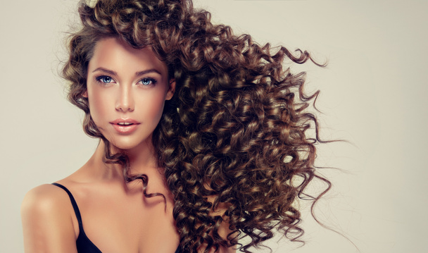 Beautiful girl with long curly hair  - Photo, Image