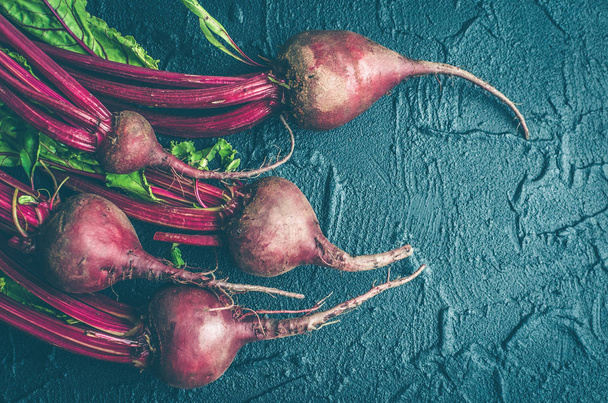 Young beets on dark stone table - Photo, Image