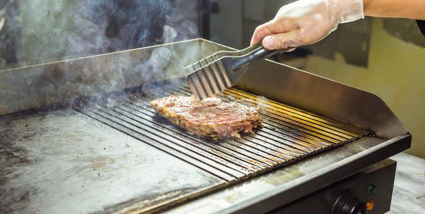 closeup of a steak on grill - Fotó, kép
