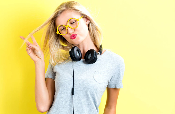 Happy young woman with headphones - Фото, изображение