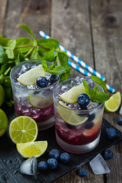 Blueberry mojito on rustic wood background - 写真・画像