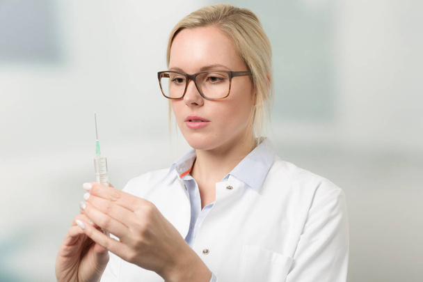 young female doctor with syringe - Zdjęcie, obraz