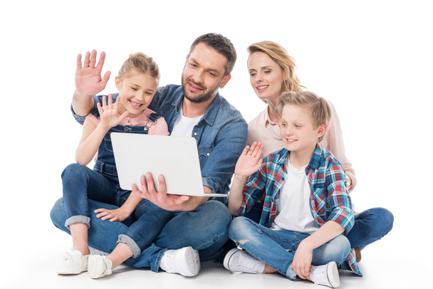 family using laptop   - Фото, изображение
