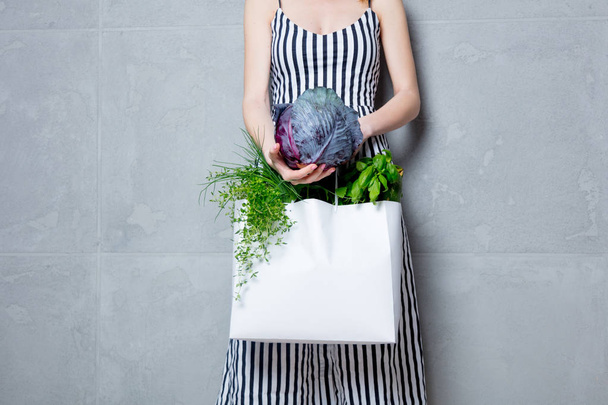 woman holding bag with vegetables - Φωτογραφία, εικόνα