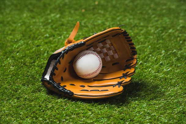 baseball glove with ball on grass - Photo, Image