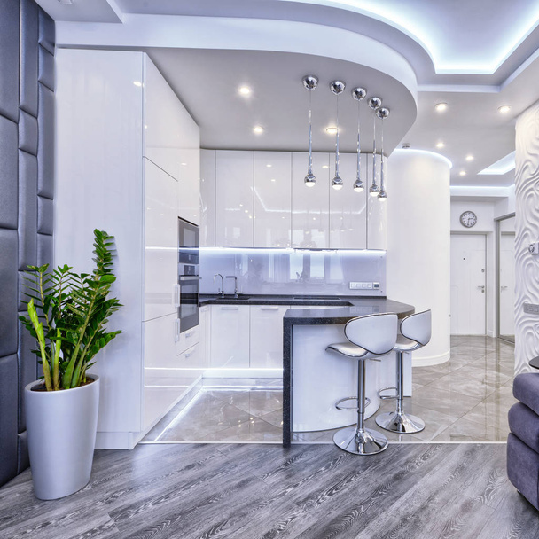 Modern design white kitchen in a spacious apartment. - Fotó, kép