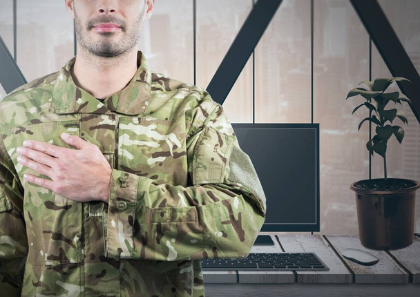Soldier with hand on heart in front of his office - Foto, Imagen