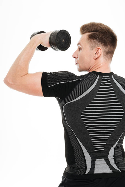 Back view photo of strong sportsman make sports exercises - Photo, image