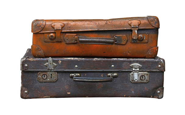 Old vintage travel suitcases isolated on white - 写真・画像