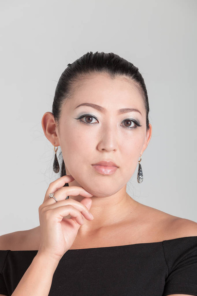 Elegant Asian woman in studio, portrait - Фото, изображение