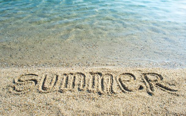 Word Summer written on the beach - Фото, изображение