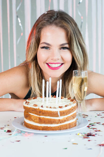 Pretty girl smiling with celebration cake - Photo, image