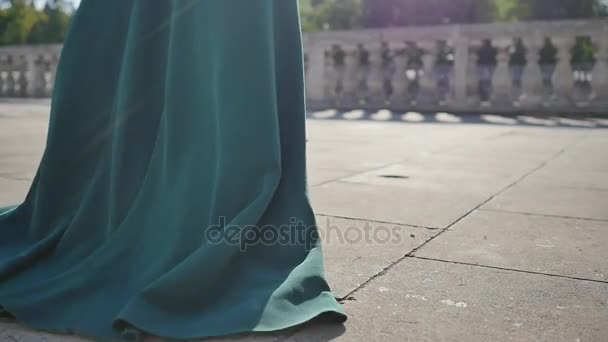 Young woman In long Dress Walking along stone path, moves away, close-up the feet, slow-motion - Imágenes, Vídeo