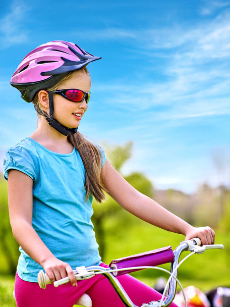 Child traveling bicycle in summer park. - Fotó, kép