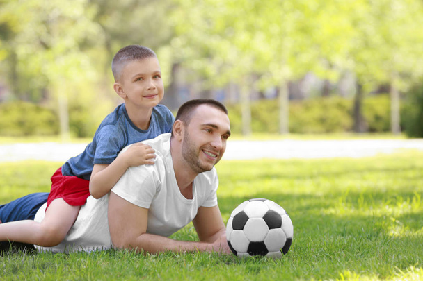 父と息子とサッカー ボール   - 写真・画像