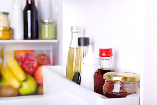 different sauces in fridge - Foto, Bild
