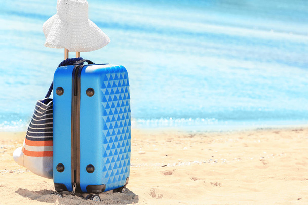 Packed suitcase and beach accessories  - Fotoğraf, Görsel