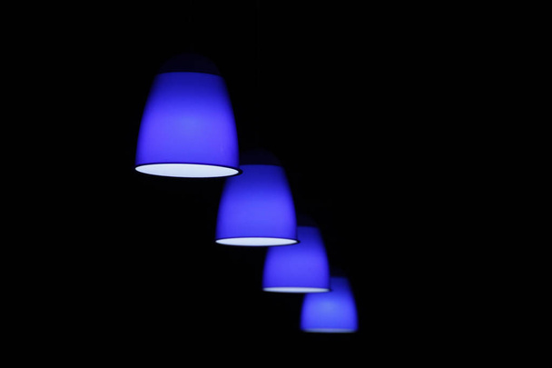 Blue luminaire against dark background - Photo, Image