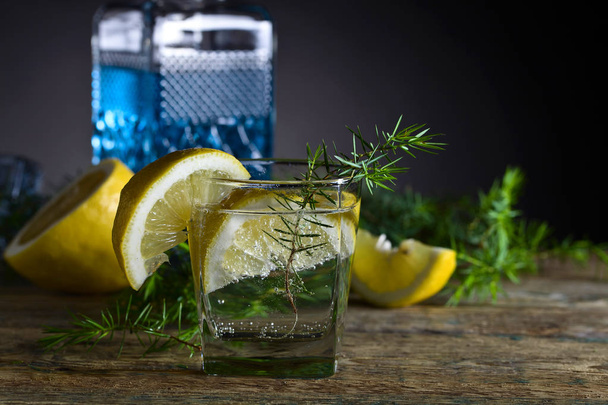 Cocktail with blue gin , tonic and lemon . - Photo, Image