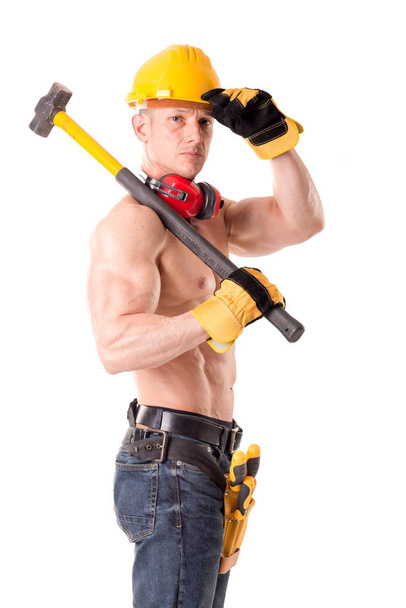 Construction worker holding hammer - Photo, Image