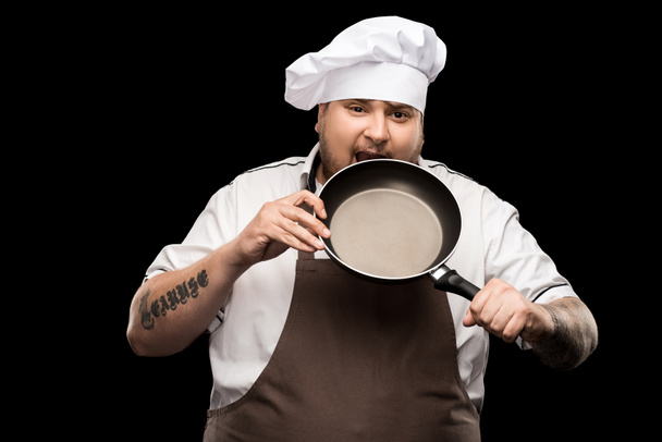 jonge chef-kok met koekenpan - Foto, afbeelding