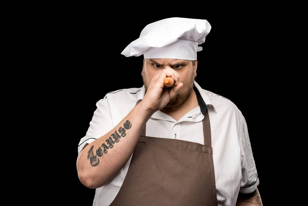 Chef segurando cenoura
  - Foto, Imagem