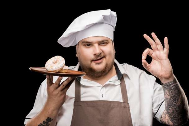 chef with doughnuts on plate - Photo, Image