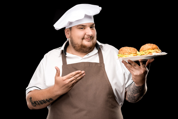 fogão com hambúrgueres na placa
 - Foto, Imagem