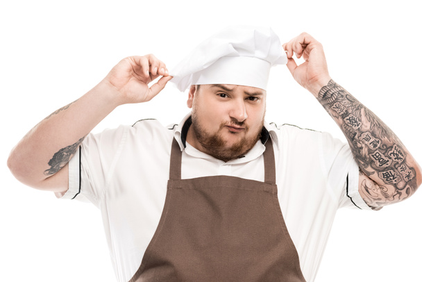 cuisinière dans tablier et chapeau de chef
 - Photo, image