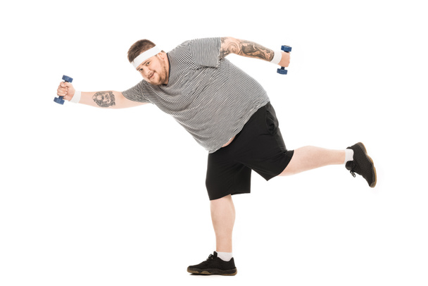 young obese man running with dumbbells - Foto, Imagem