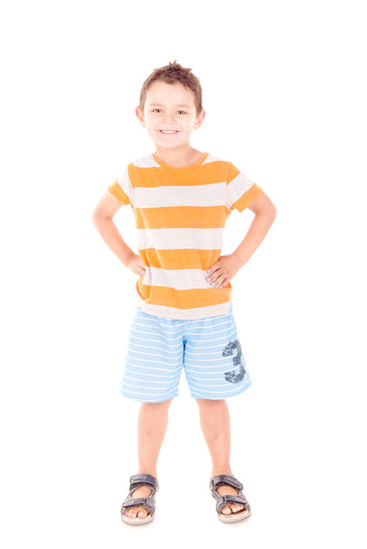 Boy wearing blue beach shorts  - Фото, изображение