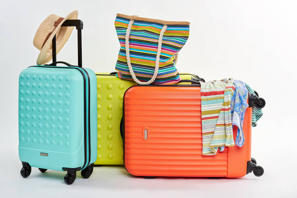 Suitcases and woman beach accessories. - Photo, Image