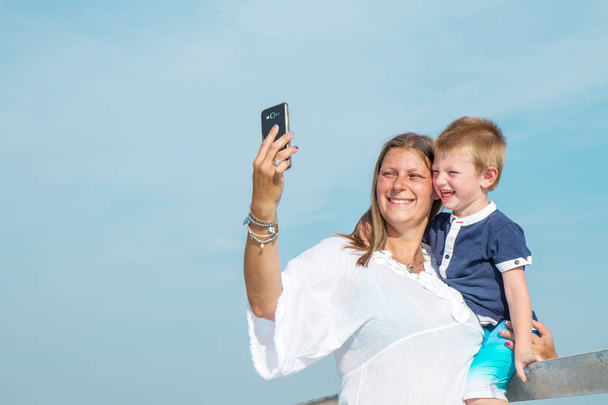mother and son doing selfie  - Photo, image