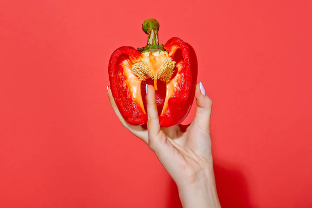 bell pepper in hand of woman hold sweet paprika, heart - Фото, изображение