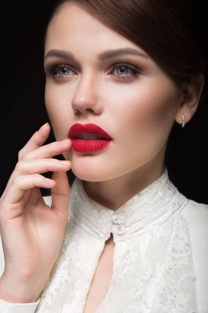 Beautiful girl with red lips in white clothes in the form of retro. Beauty face. - Foto, afbeelding