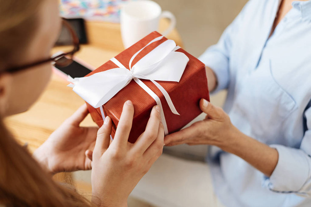 Female hands holding a gift box - Photo, Image