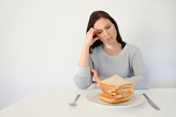 Young woman suffers from a gluten - Fotó, kép